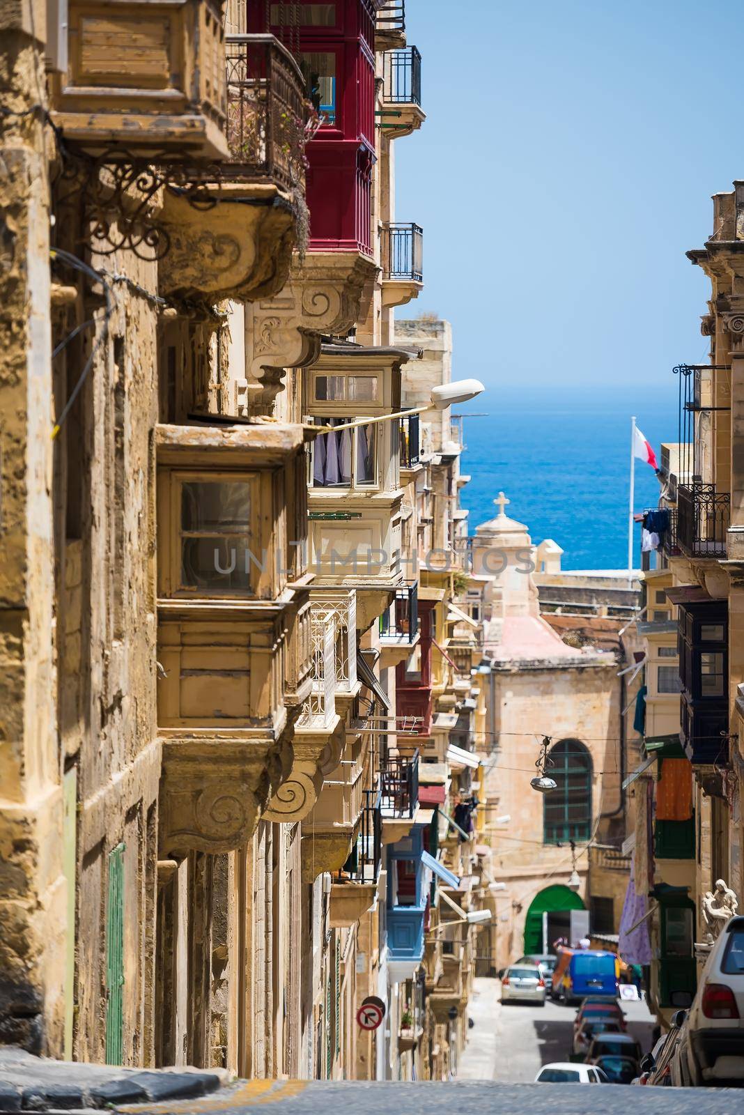 traditional Valletta street with balconies down to the sea in Malta