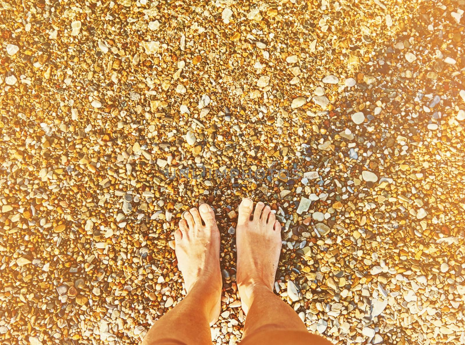 Female legs on the beach, face is not visible