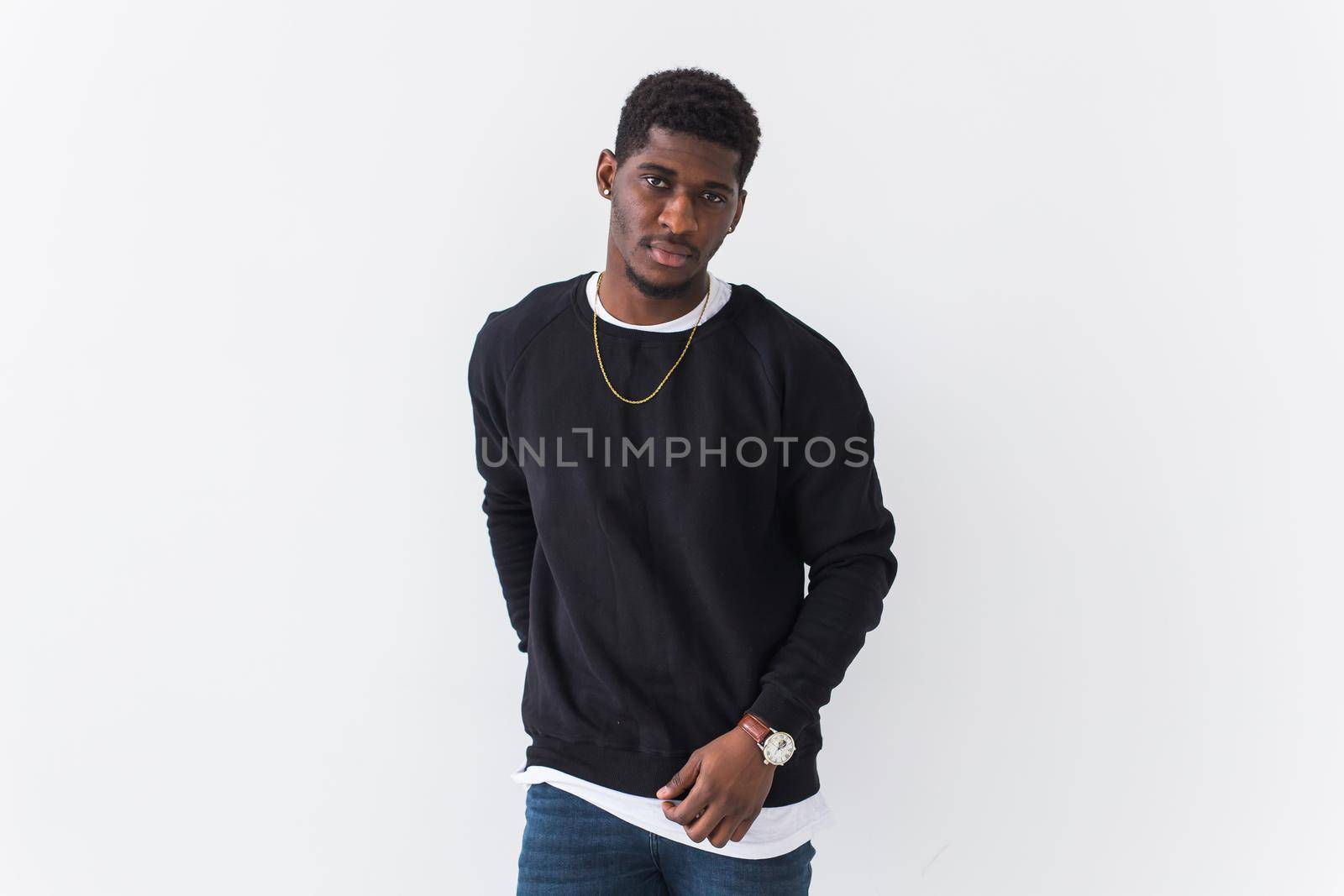 Youth fashion concept - Portrait of confident sexy black woman in stylish hoodie on white.