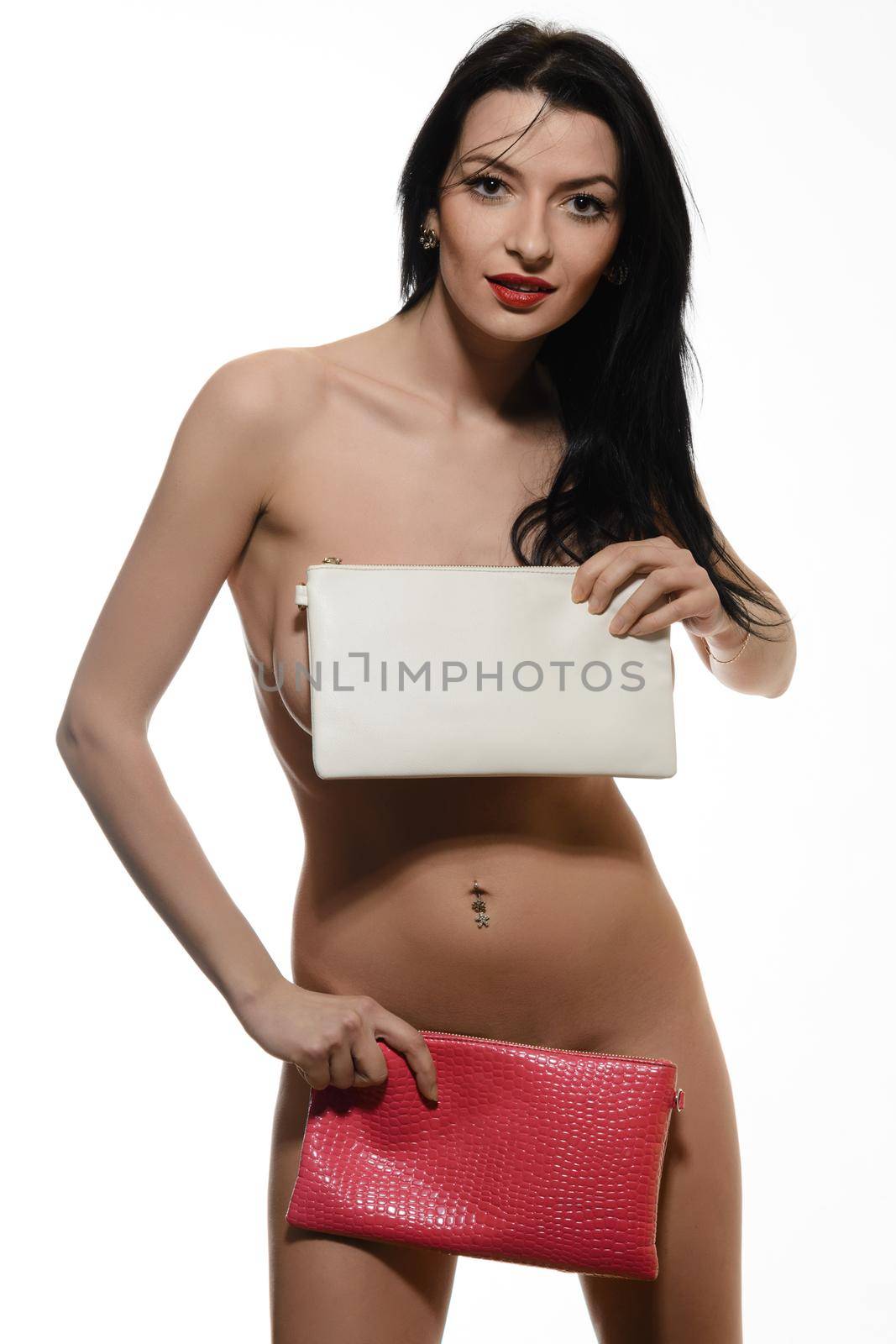 Naked young girl holding red and white leather handbag by zartarn