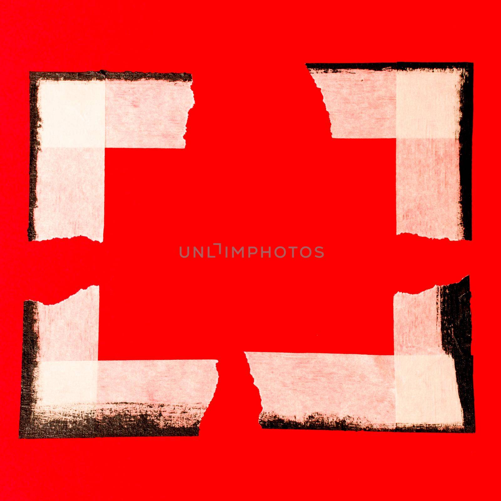 close up of an adhesive tape on red background.