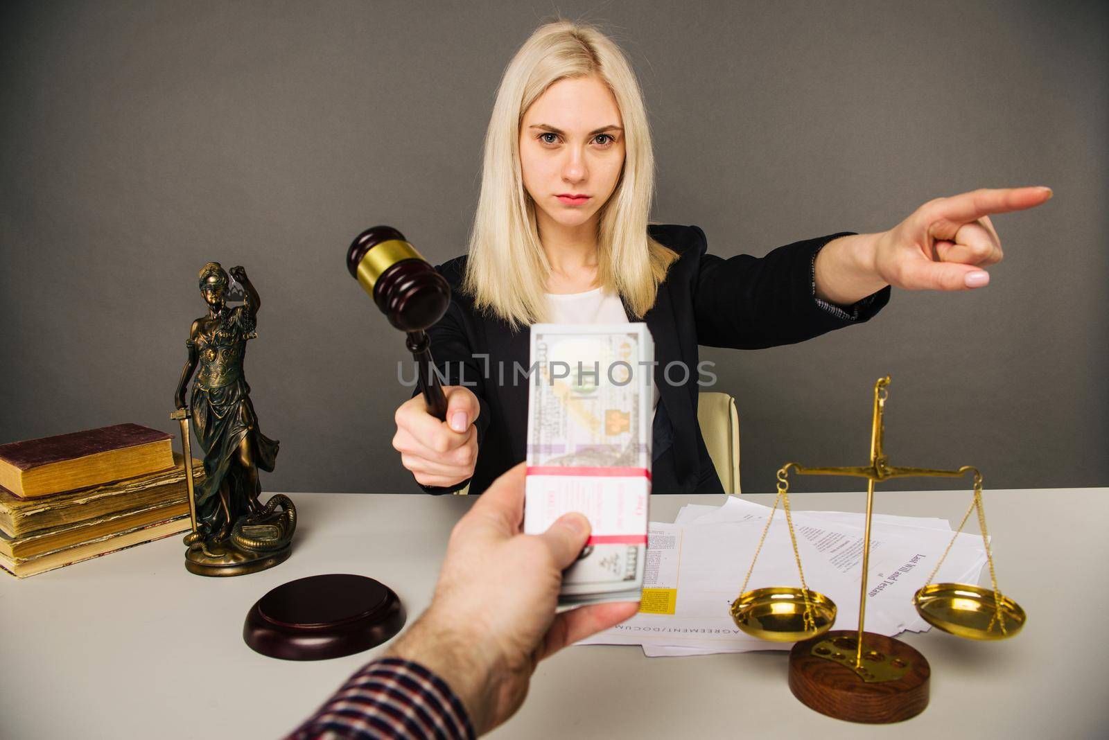 Bribing a young woman judge for a verdict in their favor -image