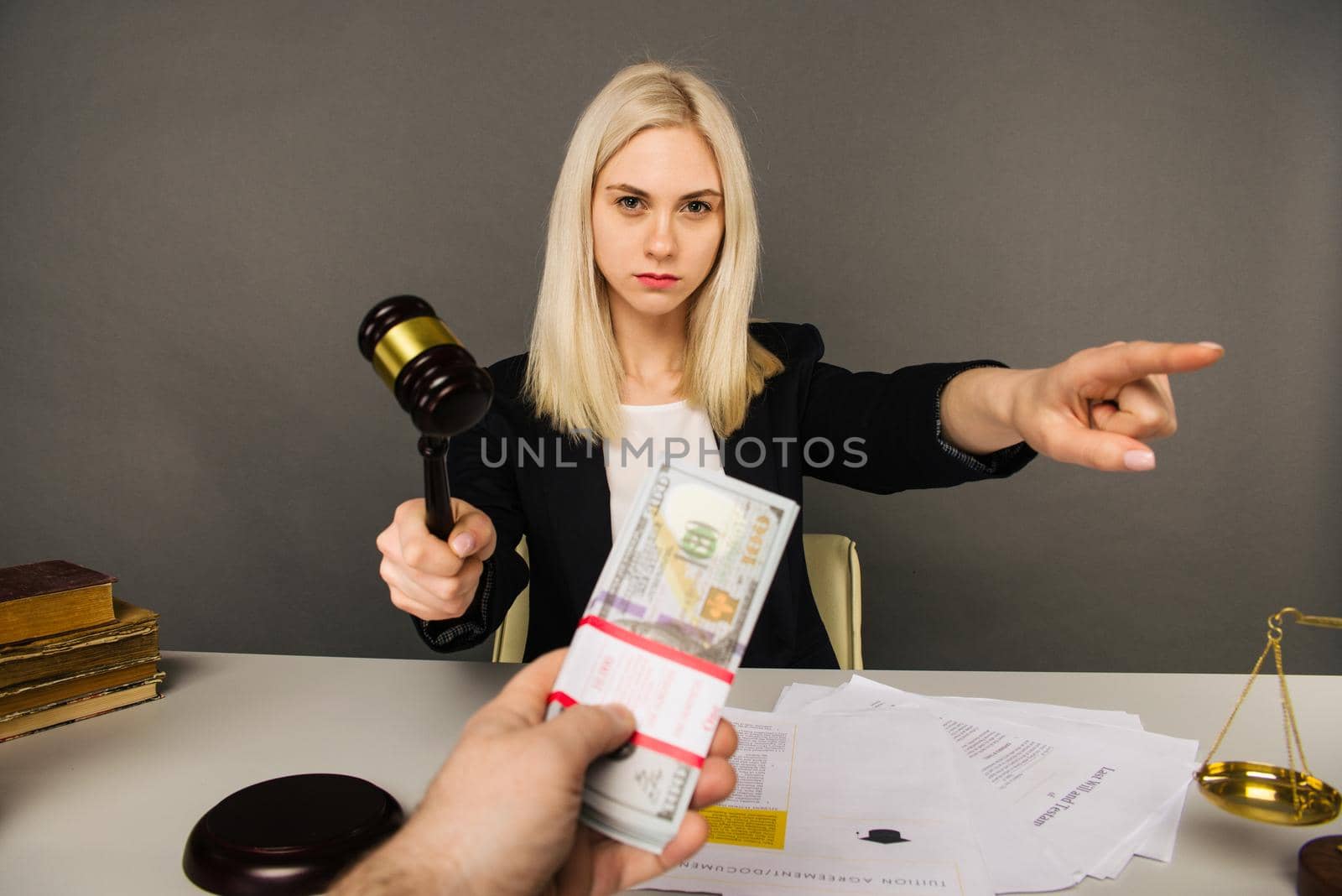 Bribing a young woman judge for a verdict in their favor -image