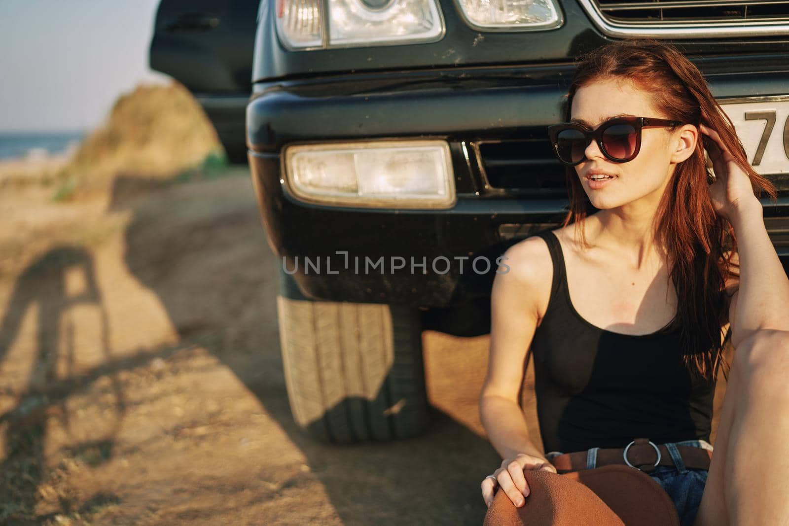 woman in sunglasses near car travel summer vacation landscape. High quality photo