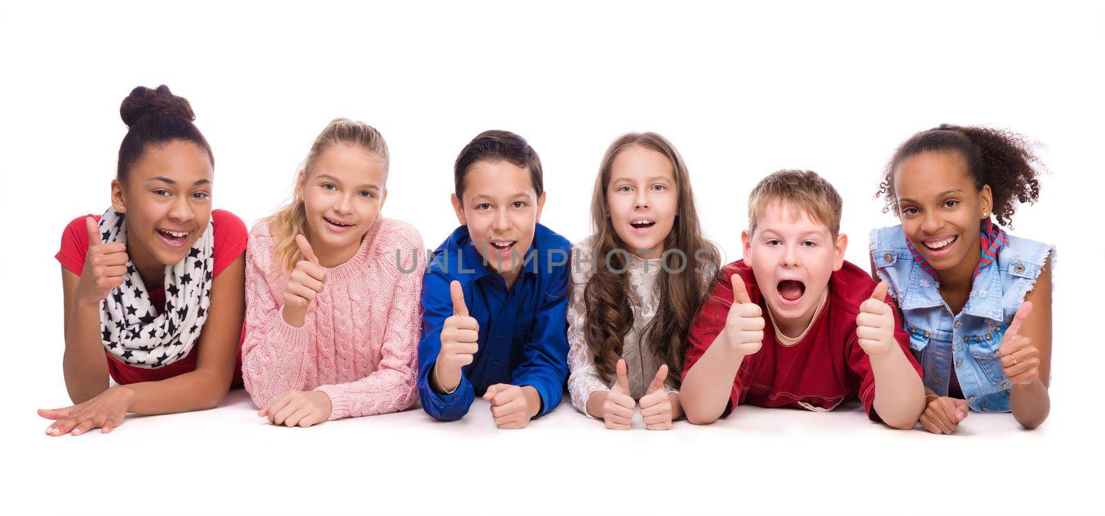 smiling children lying on the floor isolated on white backgound