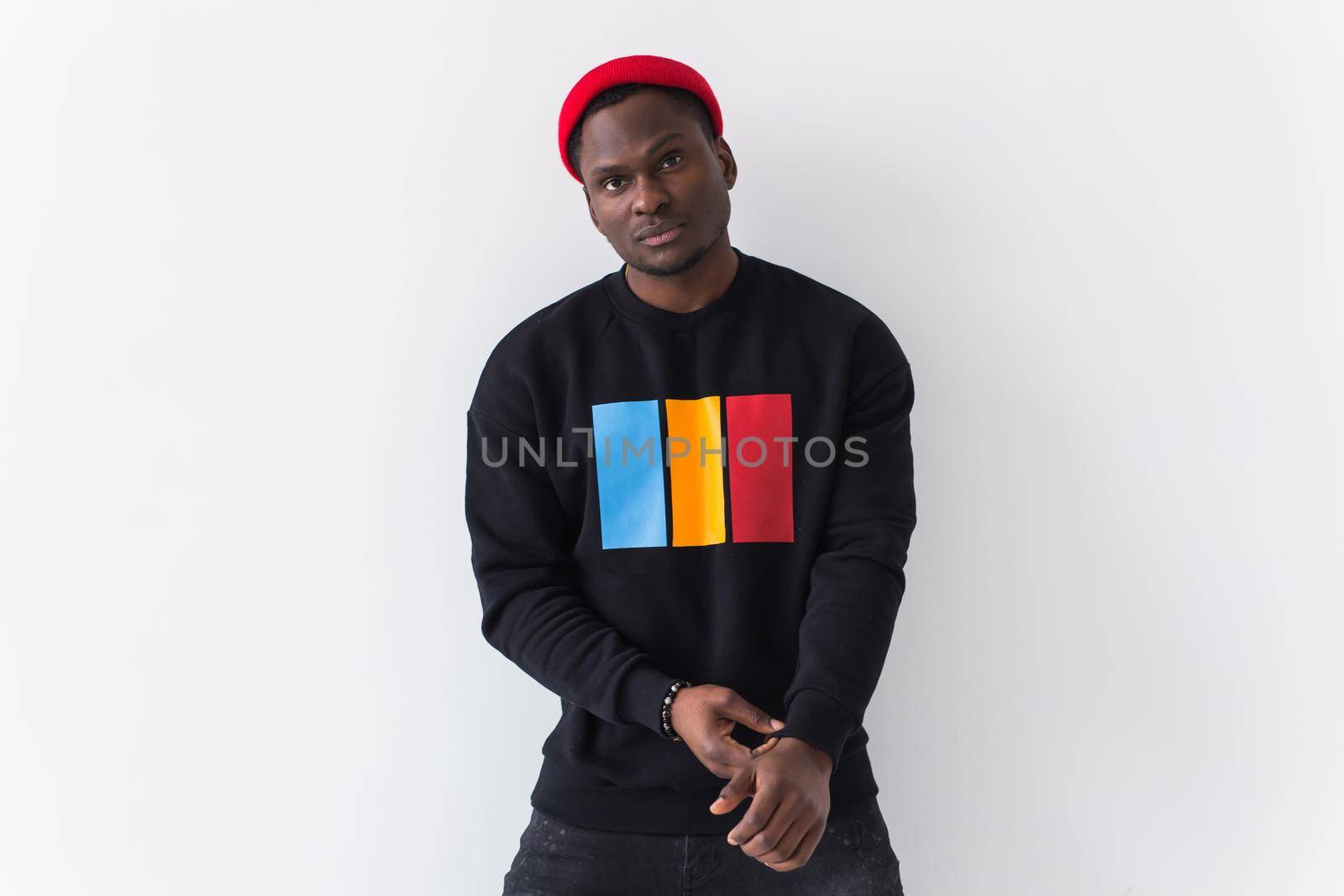 Youth fashion concept - Portrait of confident sexy black woman in stylish hoodie on white.