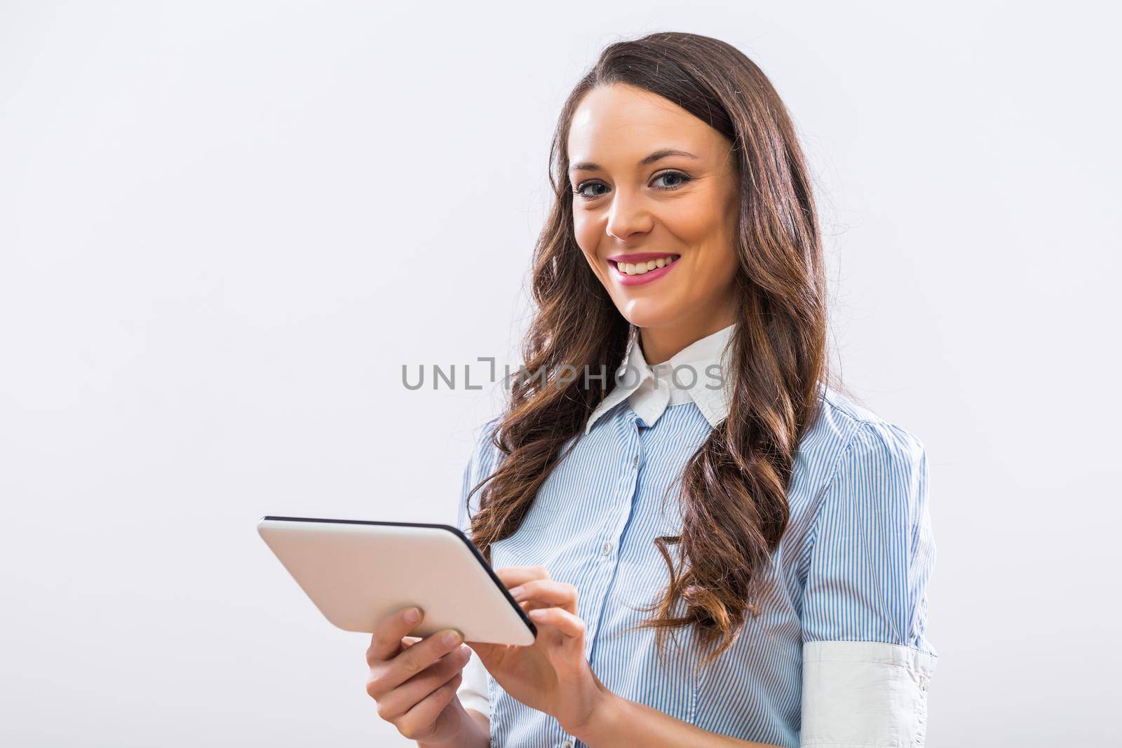 Businesswoman using digital tablet by Bazdar