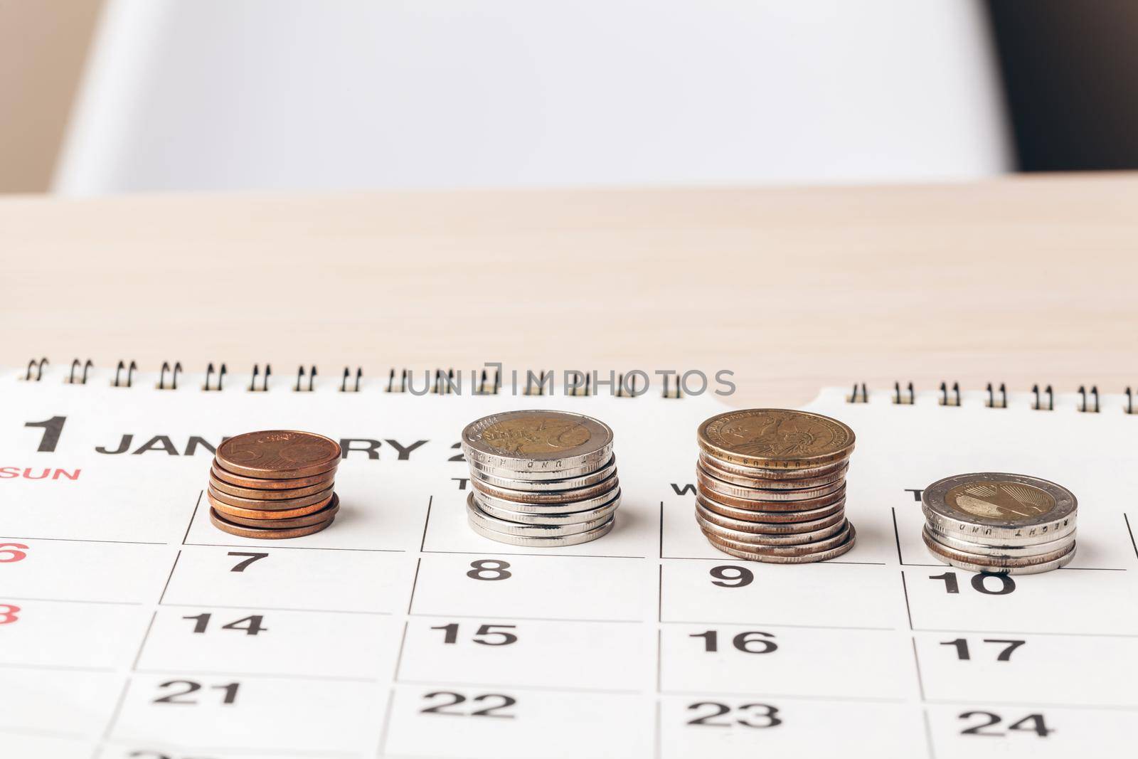 The close-up of accounting documents with money coins
