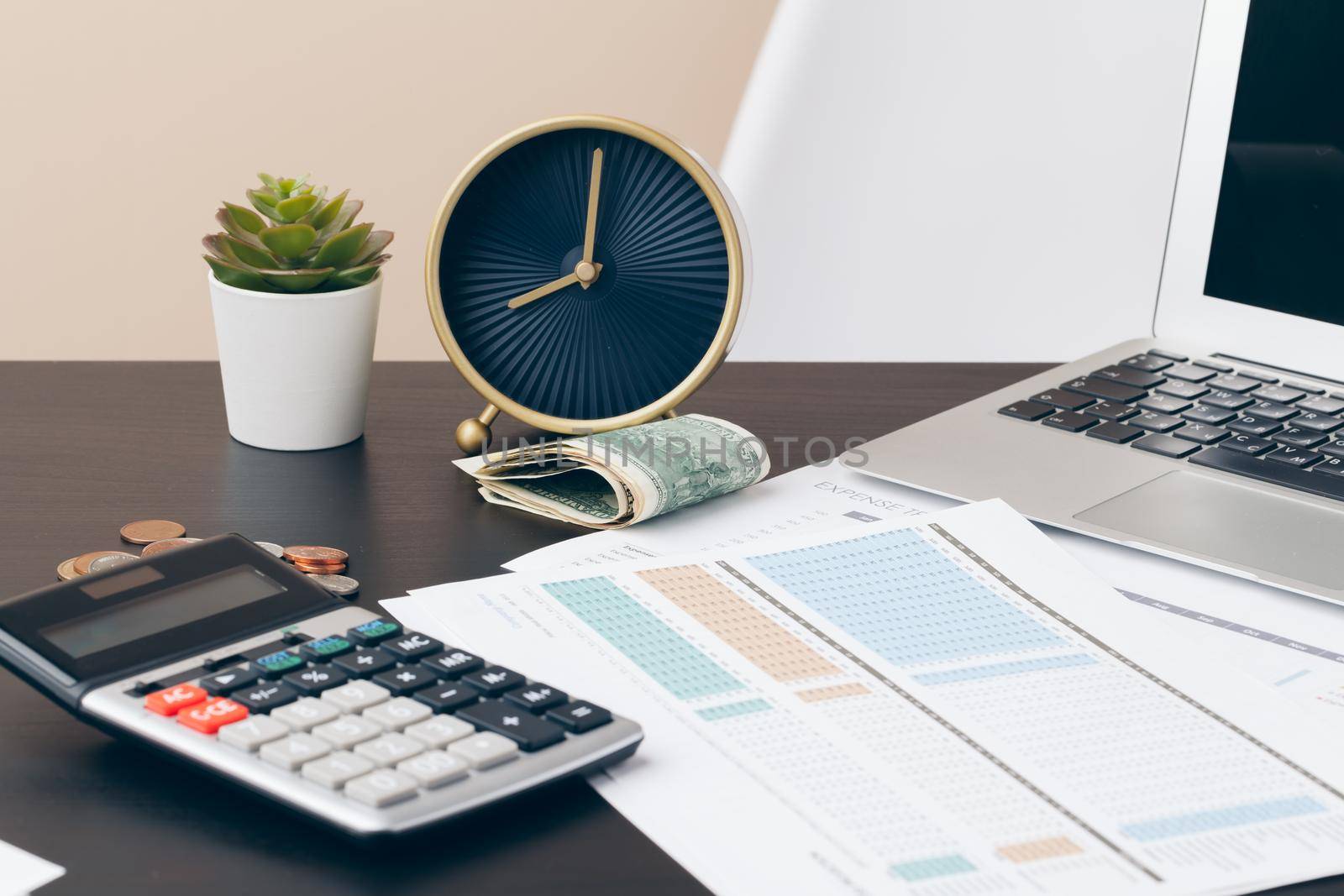avings, finances, economy and home concept - close up of calculator counting money and making notes at home