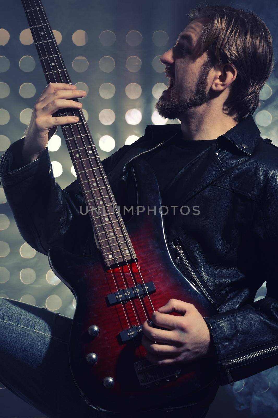 a bassist plays at a live concert