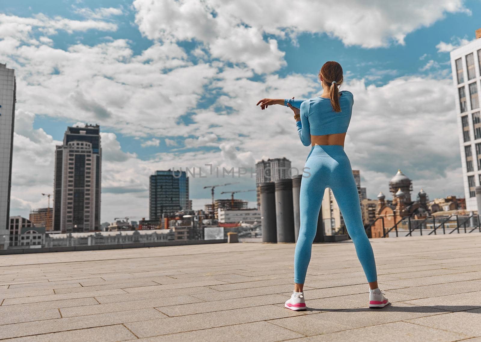 Beautiful fit young woman jogger is running outdoors