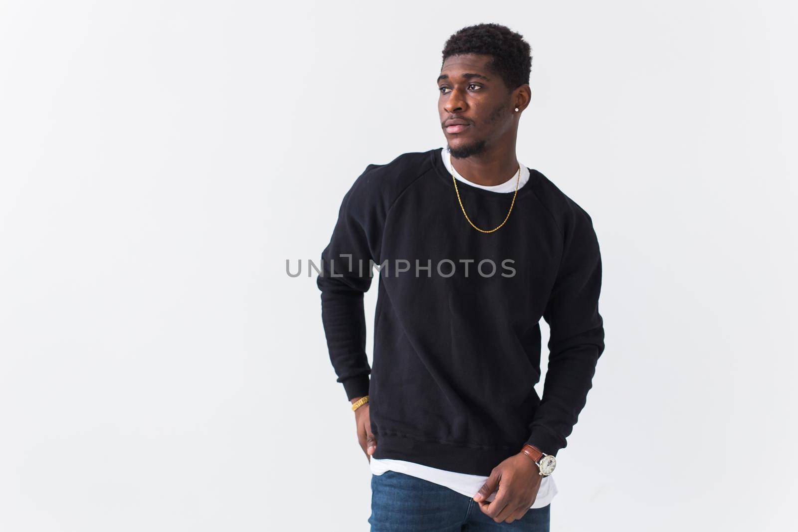 Youth fashion concept - Portrait of confident sexy black woman in stylish hoodie on white.
