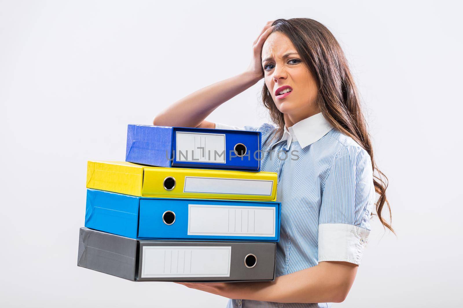 Tired businesswoman holding office archives by Bazdar