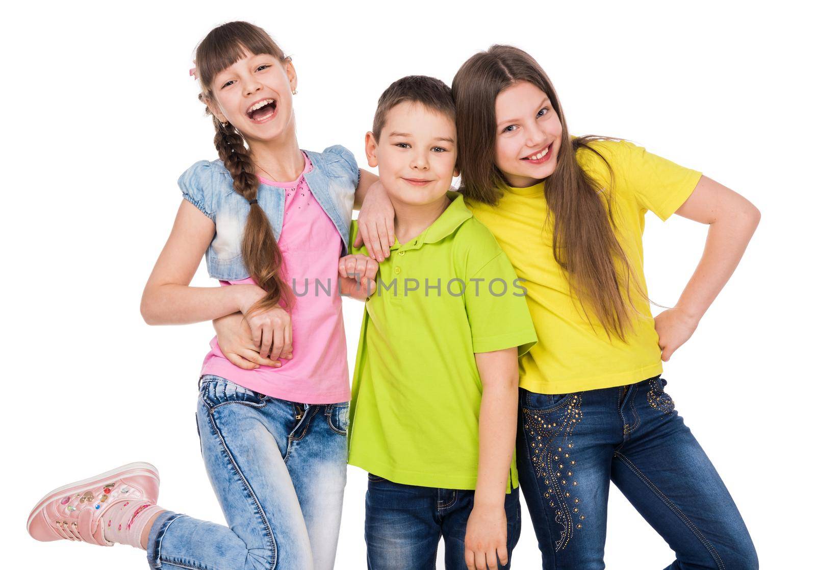 little cute boy embracing two laughing little girls isolated on white background