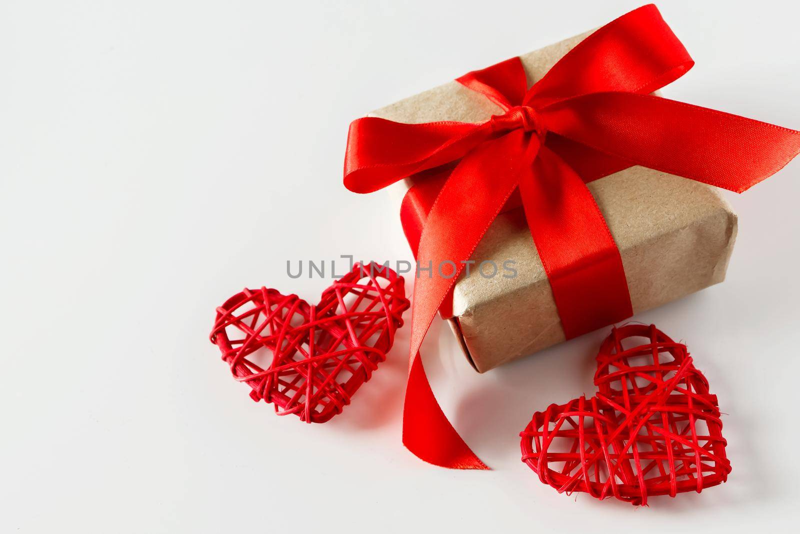 Valentine's day gift and red hearts on a white background by Statuska