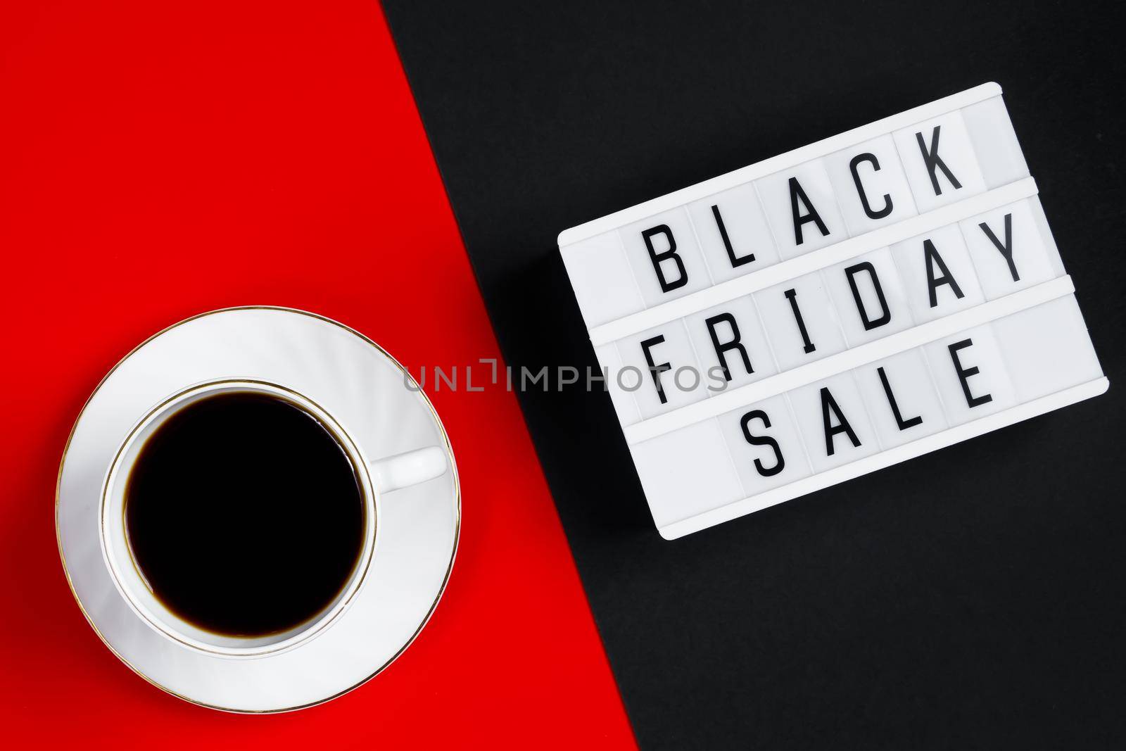 Black Friday sale concept. Cup of coffee on a red background. Banner for advertising.