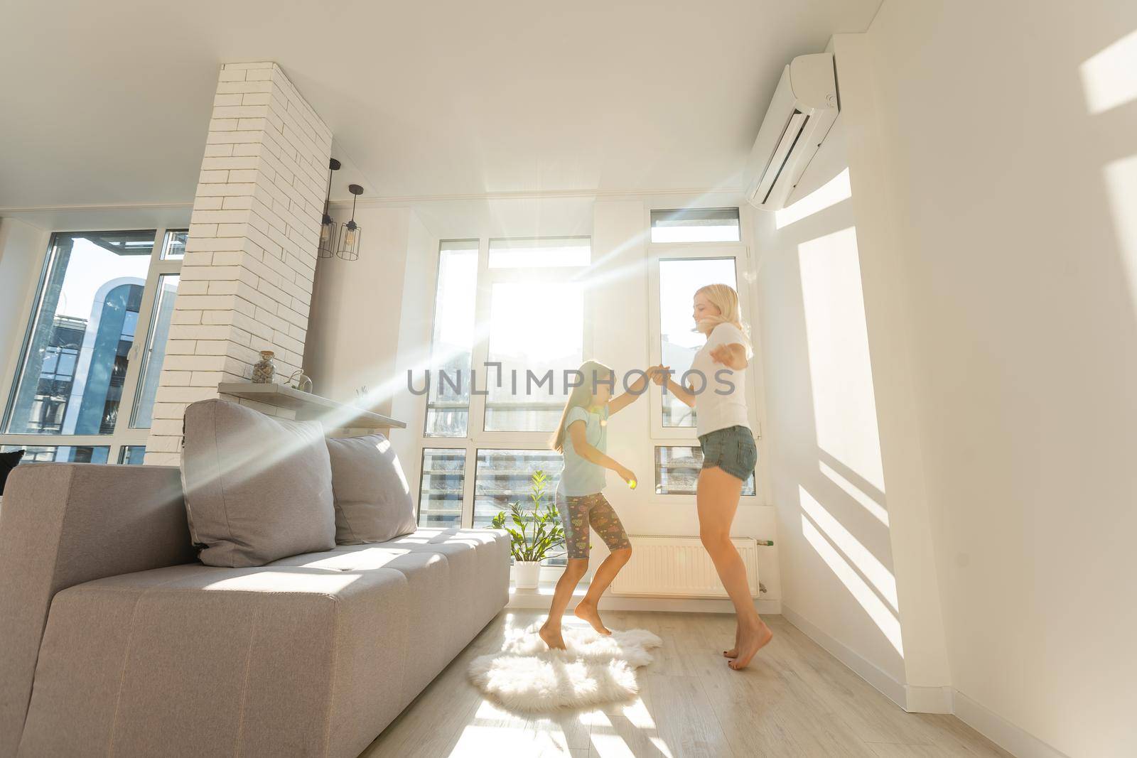 Happy loving family. Mother and her daughter child girl playing and dancing together