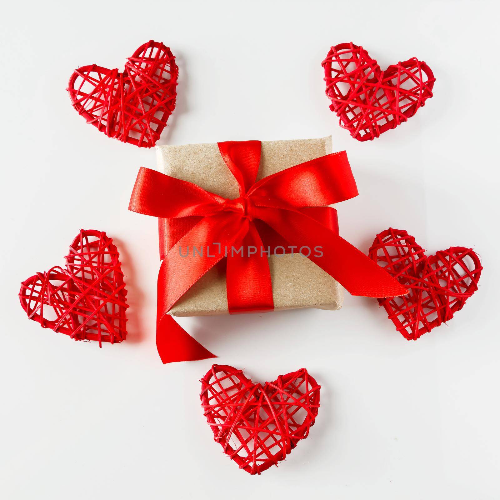 Valentine's day gift and red hearts on a white background by Statuska