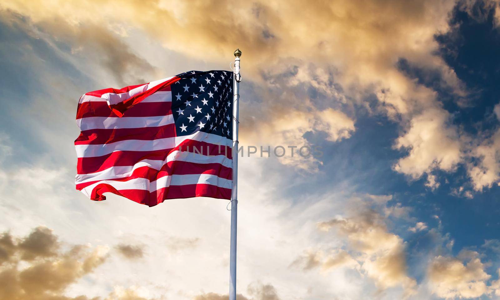 american flag waving in the sky