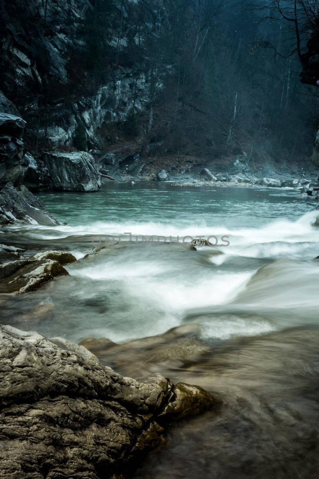 beautiful landscape with river flowing in mountains