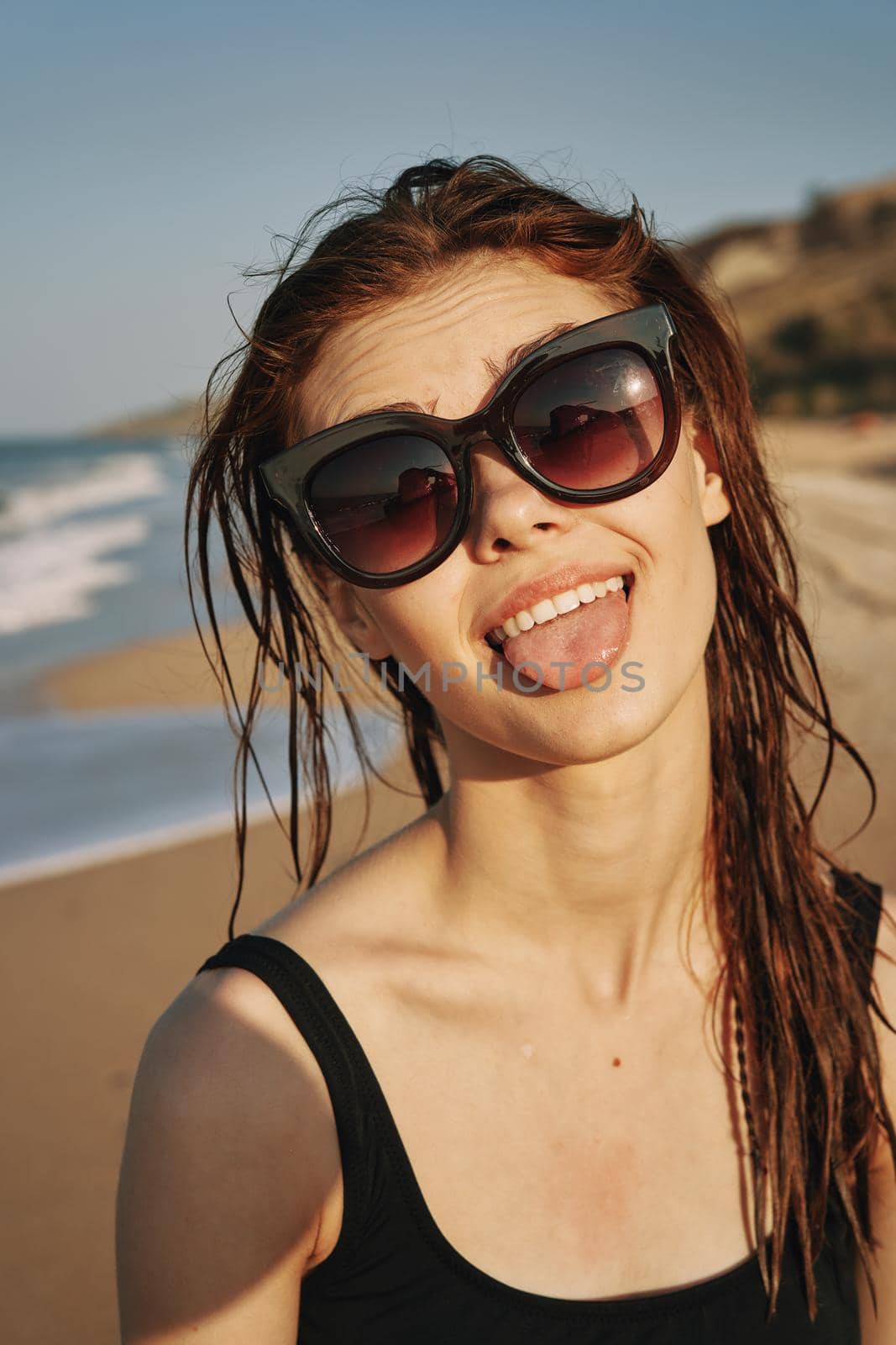 cheerful woman sunglasses posing black swimsuit island by Vichizh