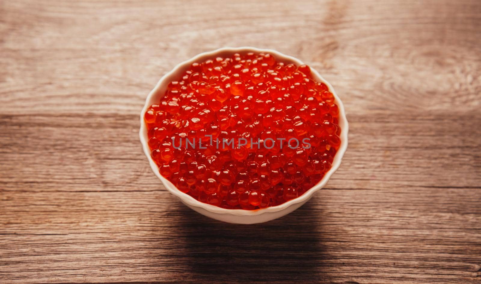 Red salmon caviar in a bowl by alexAleksei