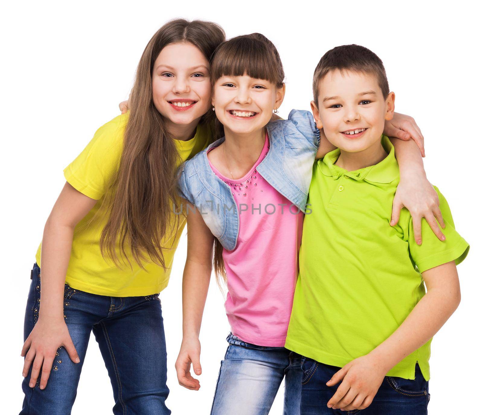 three little happy smiling children embrasing each other isolated on white background