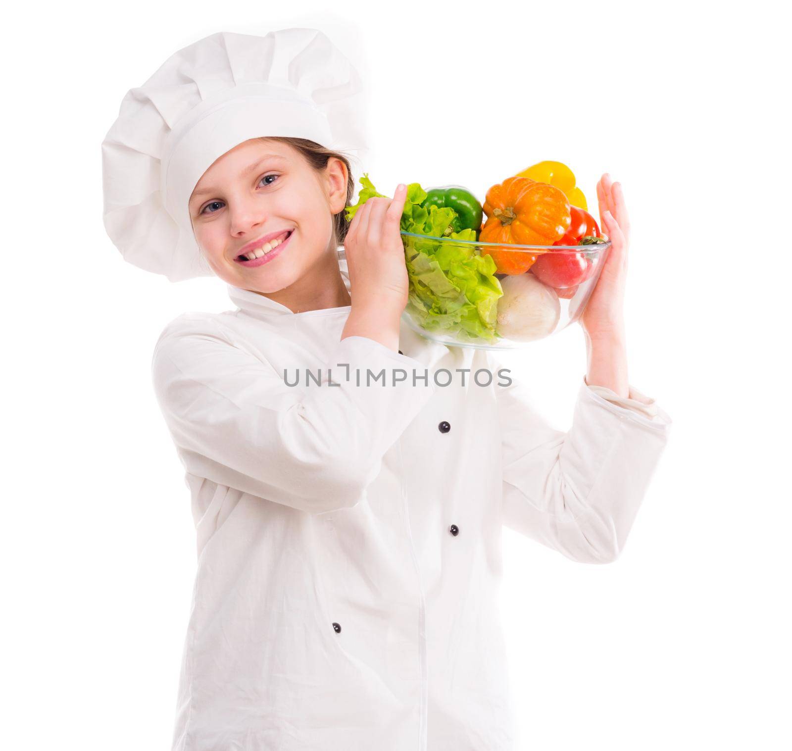 smiling little girl-cook with bowl of vegetables on shoulder isolated on white background