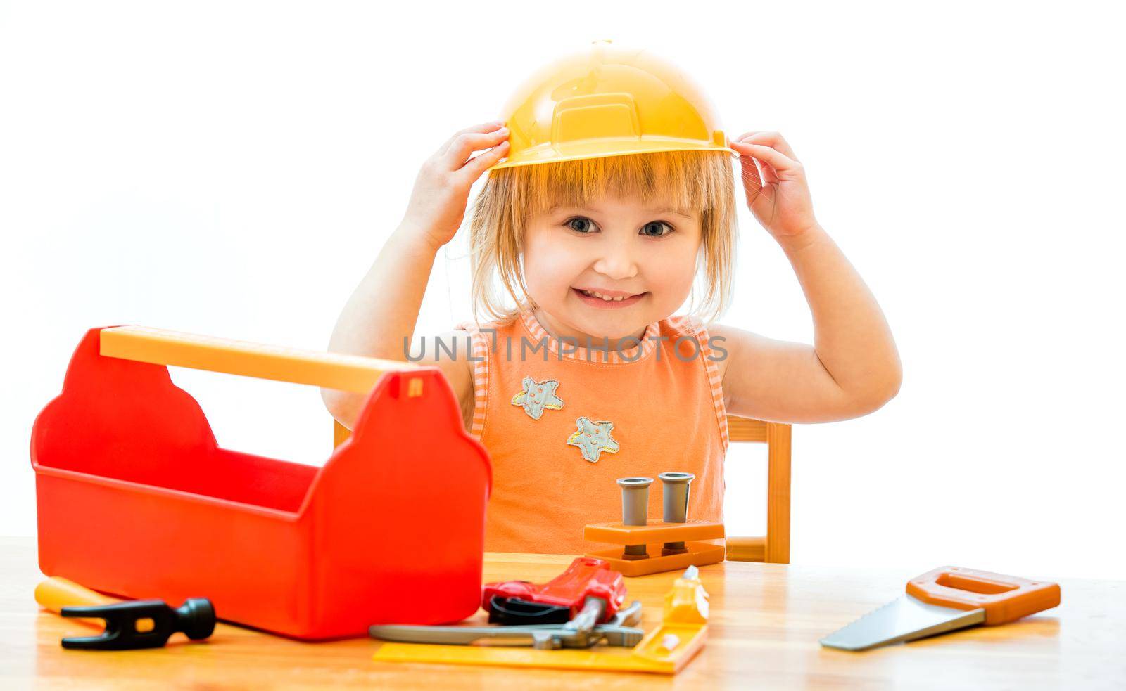 cute little kid with toy tools isolated on a white background