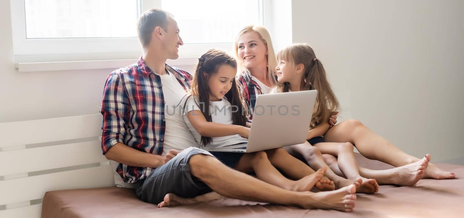 Animated family buying online lying down on bed at home by Andelov13