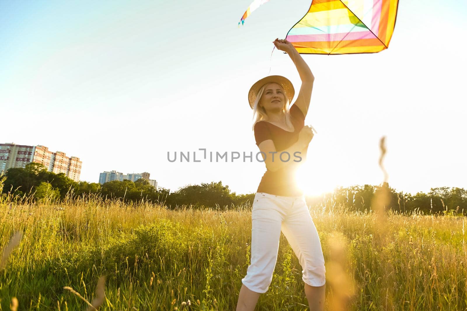 woman with a kite in the field