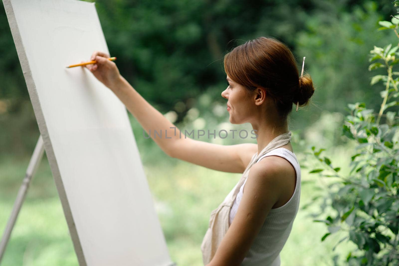 woman artist nature easel drawing creative landscape. High quality photo