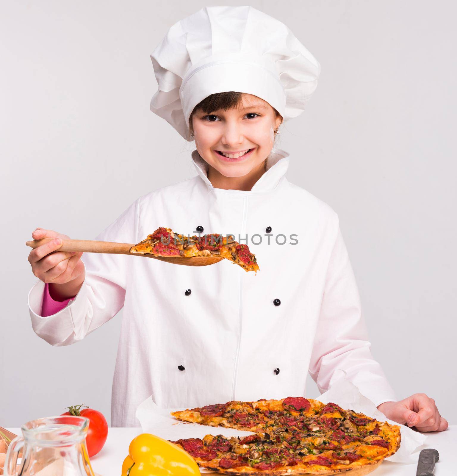 little smiling girl-cook in uniform with big pizza