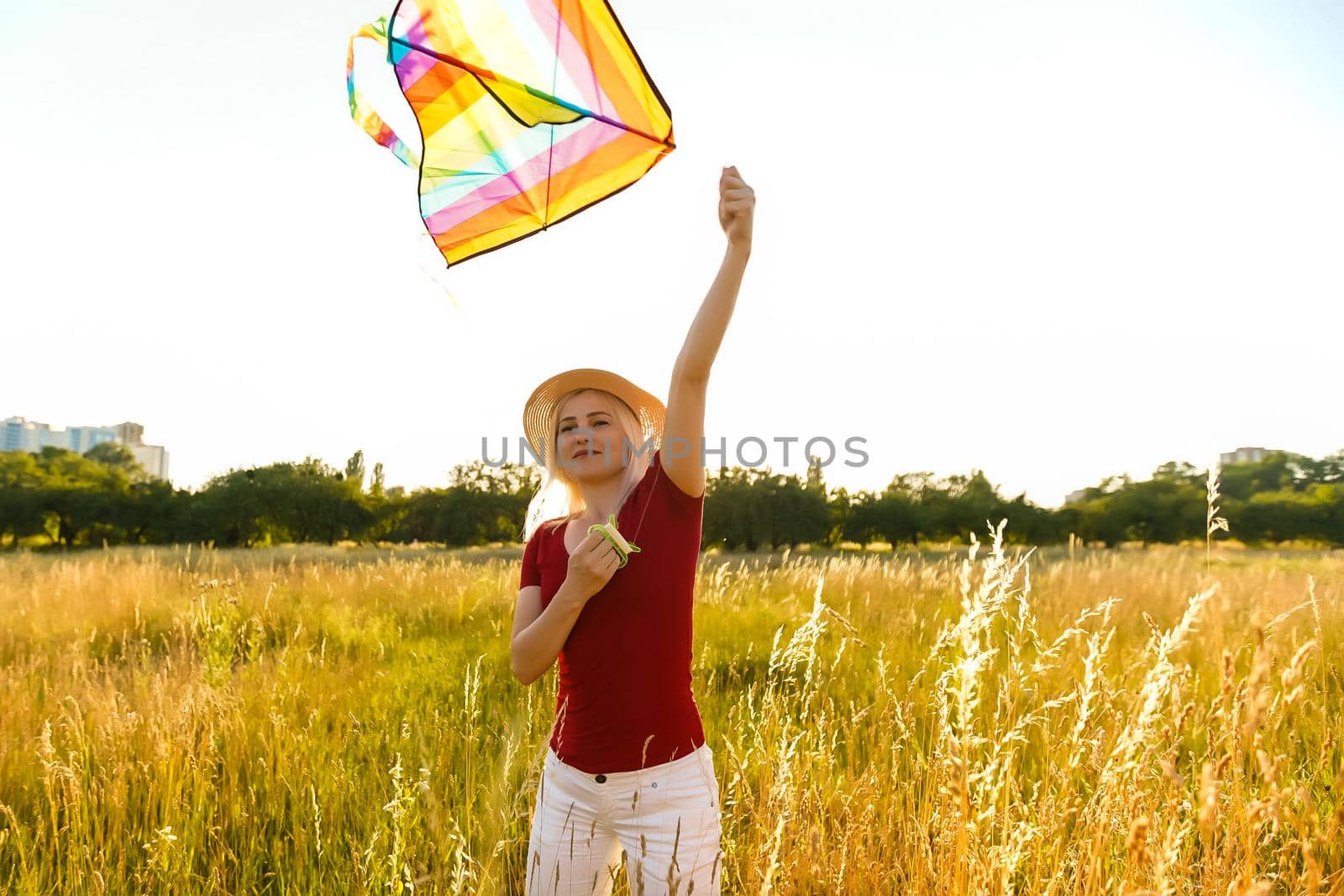 woman with a kite in the field