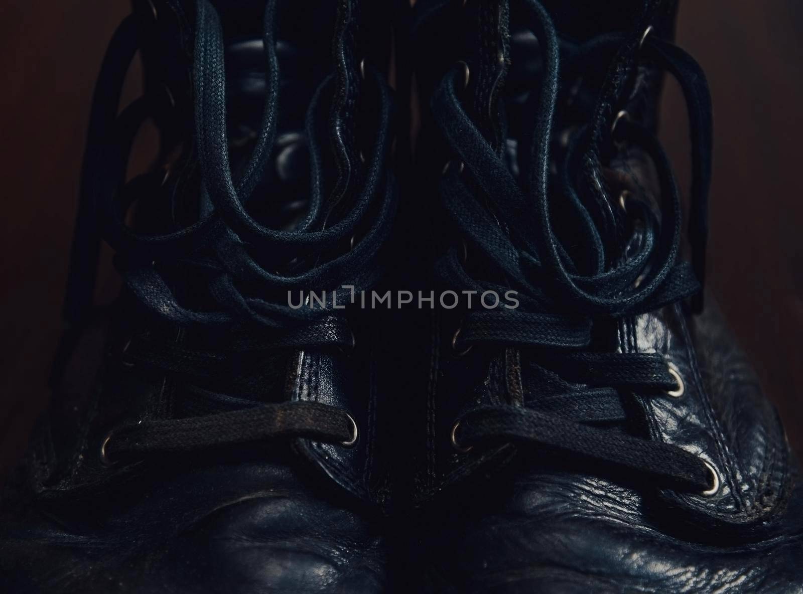 Black leather boots with shoelaces, close-up