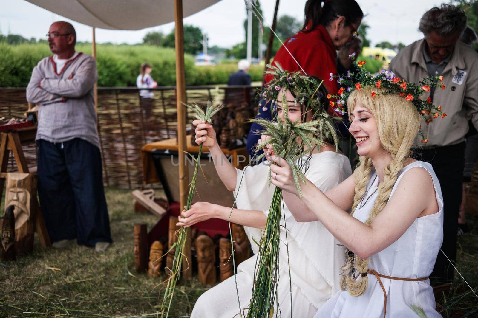 Warsaw, Poland - 8 March 2015: girls with herbal wreaths on midsummer holiday