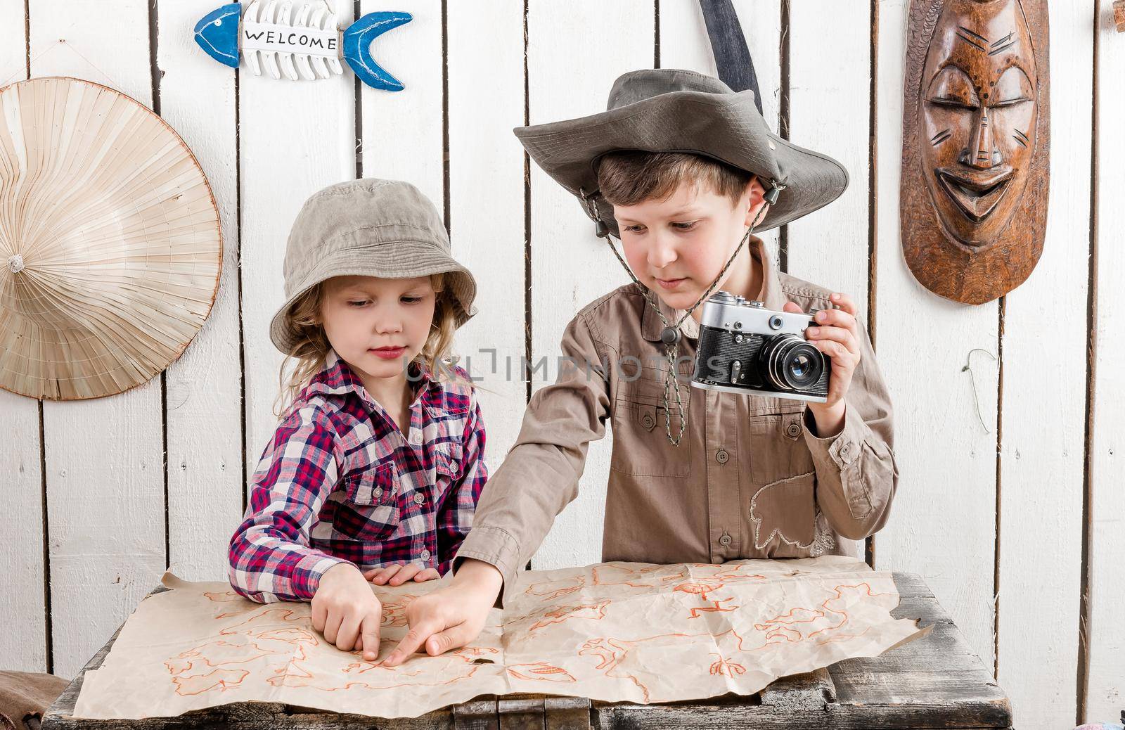 two little children watching map by GekaSkr
