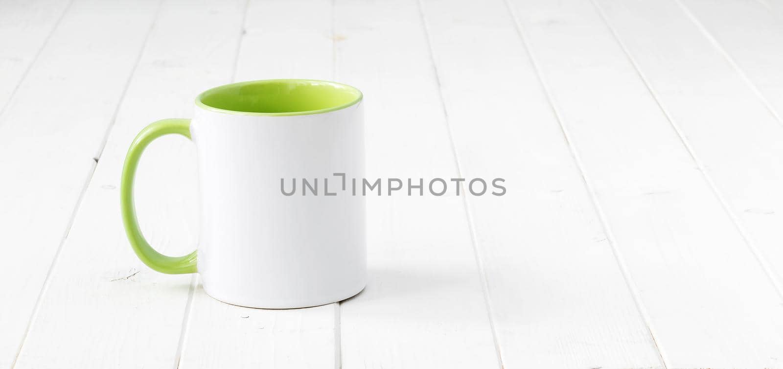 white cup with light green handle and inside by GekaSkr