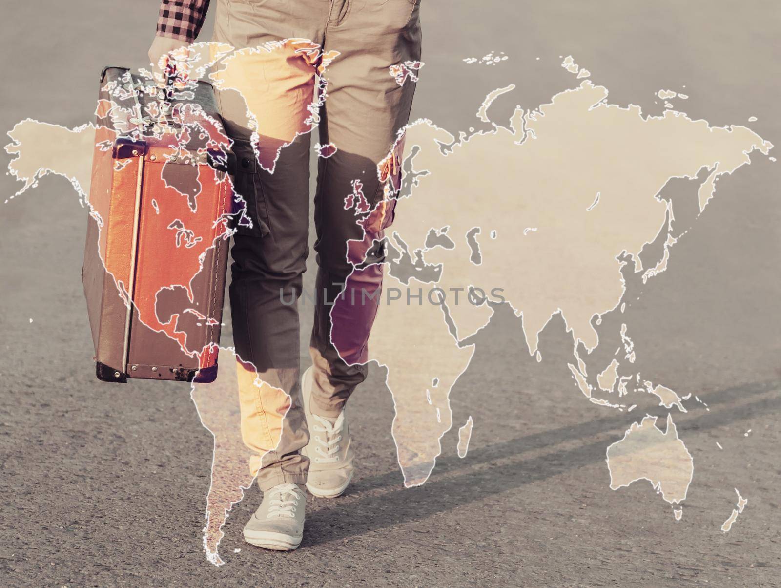 Double exposure map of the world combined with image of traveler with suitcase. Concept of travel