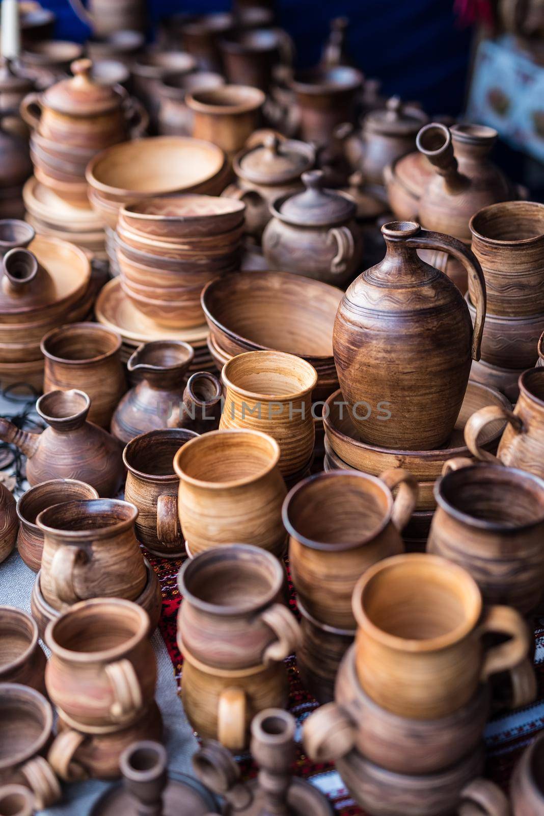 different wooden handmade kitchenware on market stall