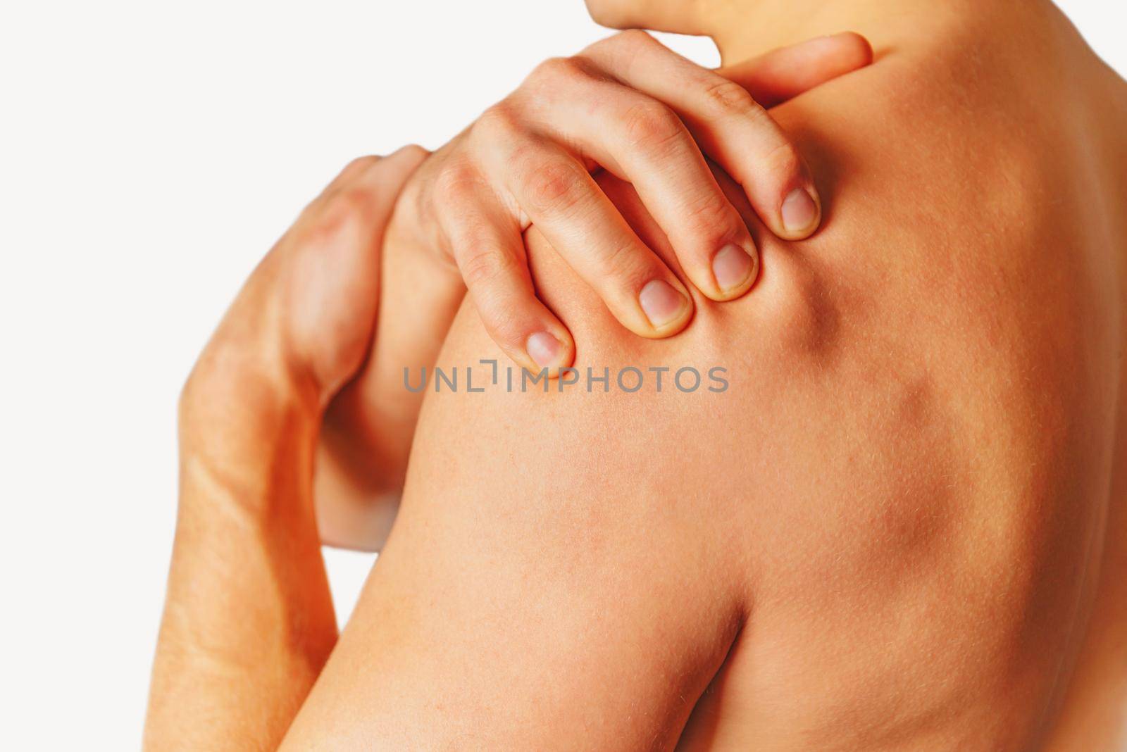 Man compresses his shoulder, pain in the shoulder.