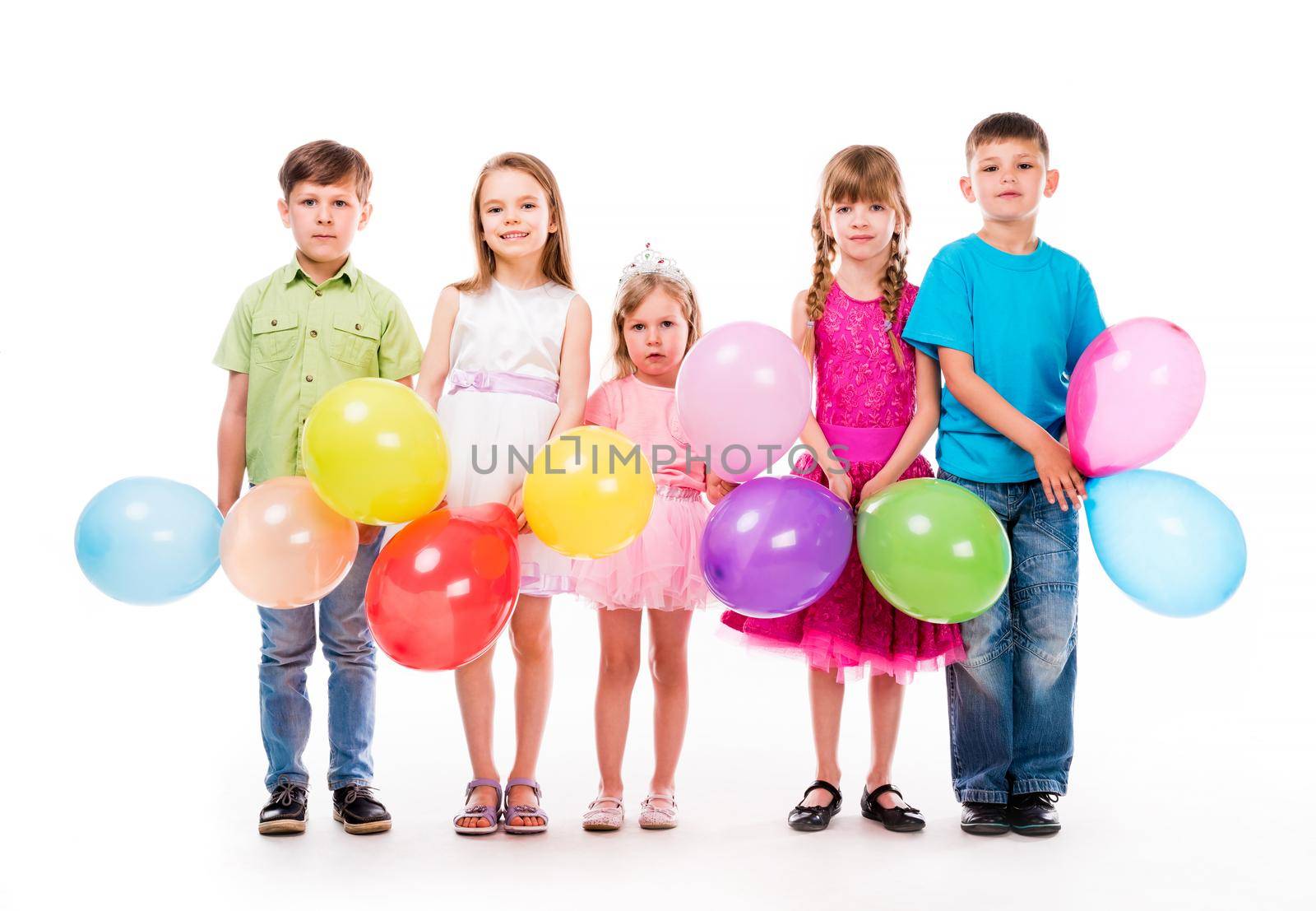 cute children celebrating birthday with decorations