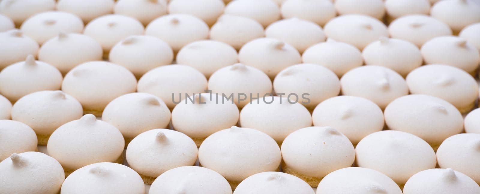 Background of sugar cookies in white glaze, close-up view, shot from above.