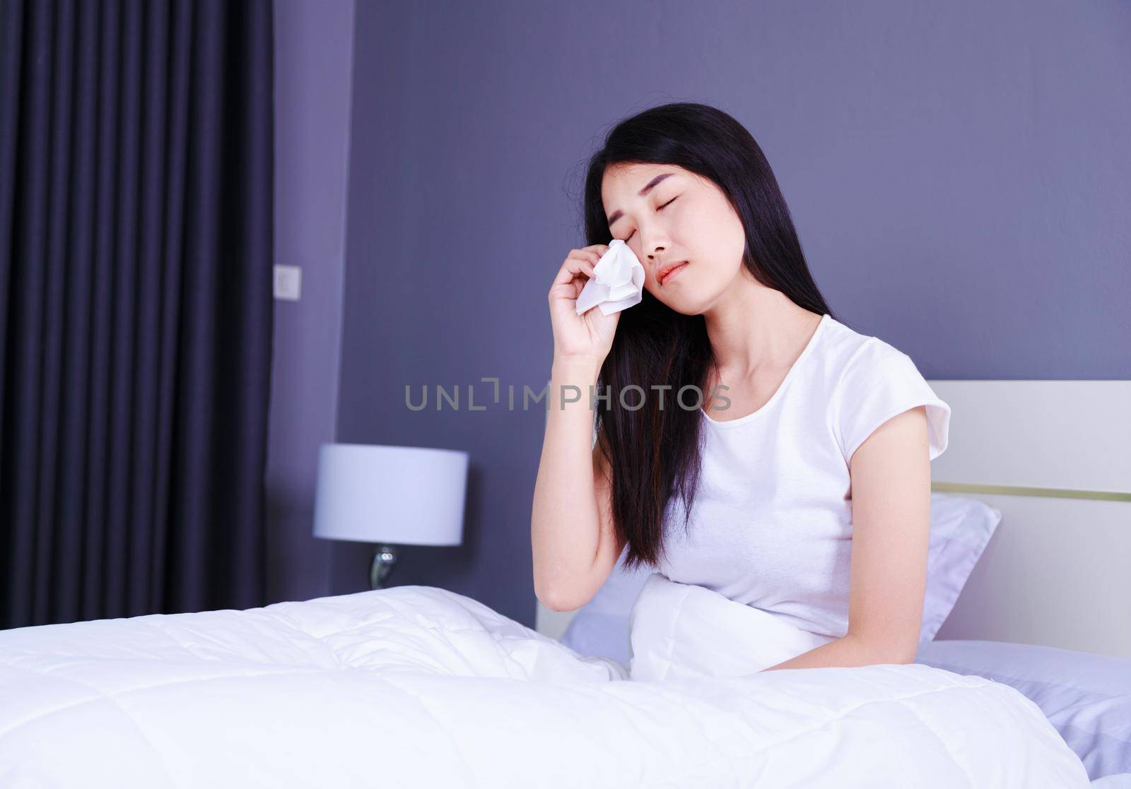 woman is crying on bed in bedroom by geargodz