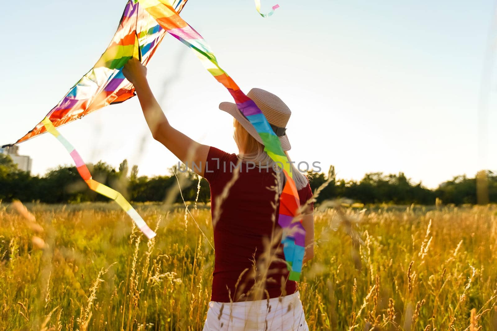 woman with a kite in the field