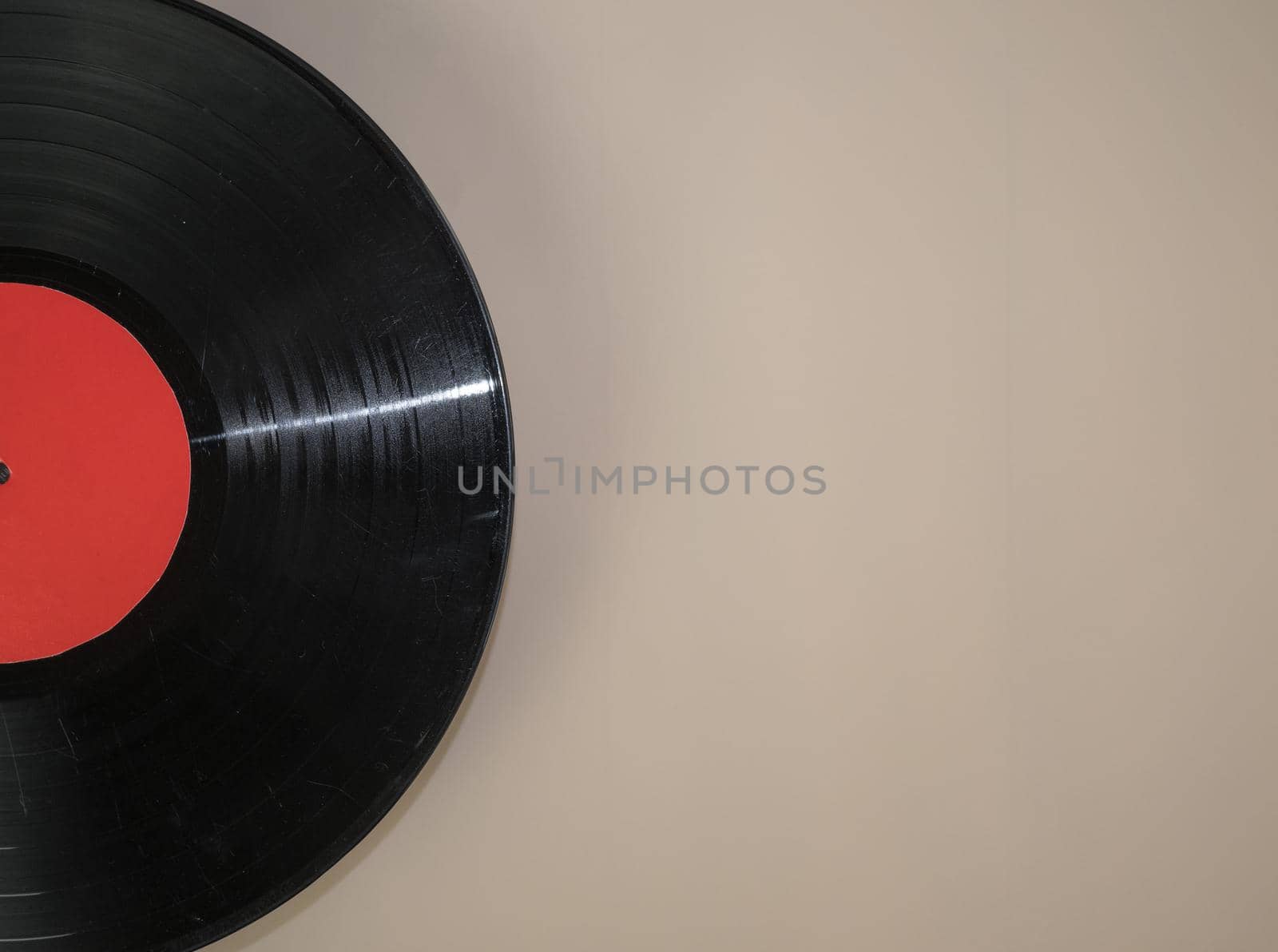 vinyl record on beige background.