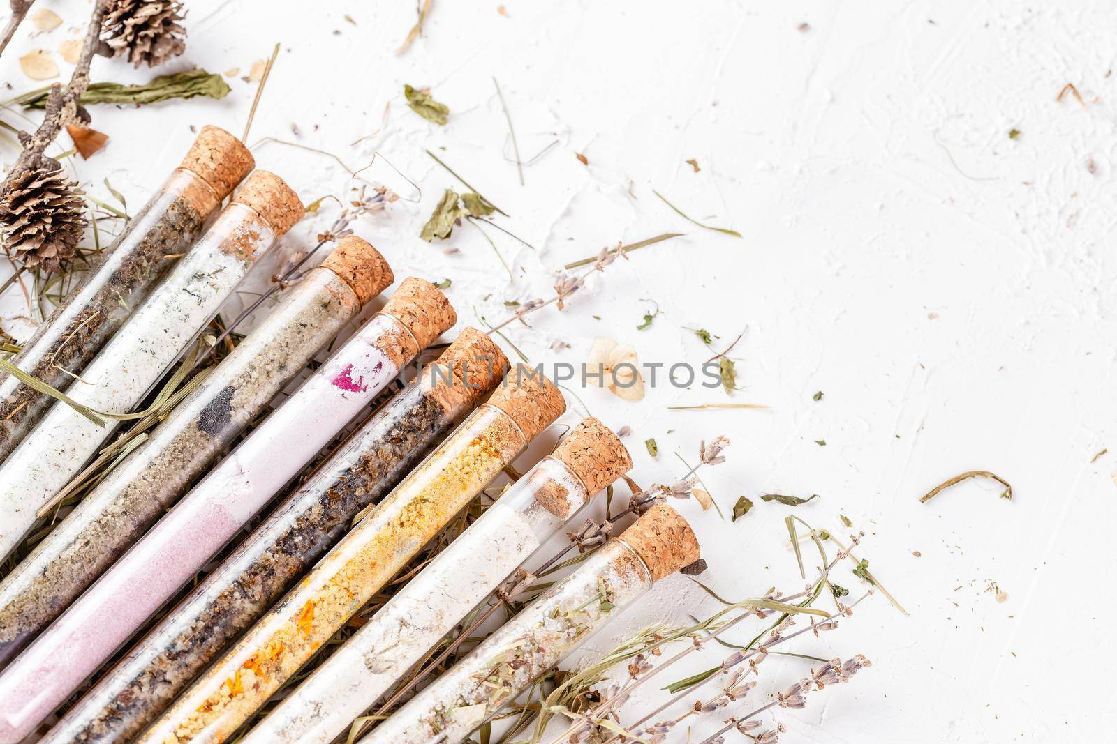 Flat lay of bath salts set in glass tubes by Syvanych