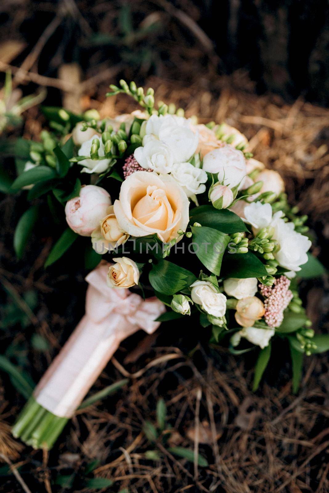 elegant wedding bouquet of fresh natural flowers and greenery