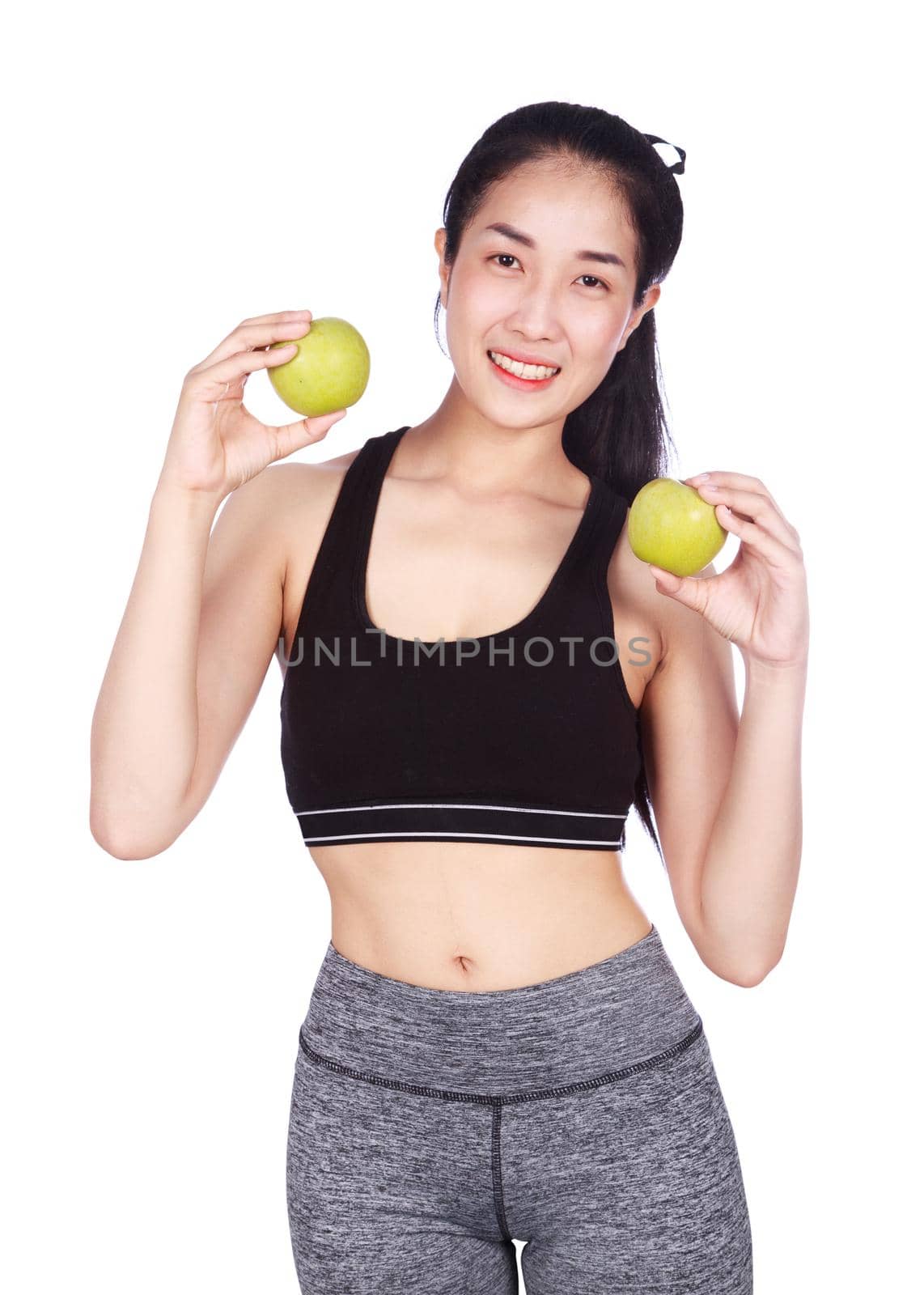 young fitness woman with green apple isolated on a white background