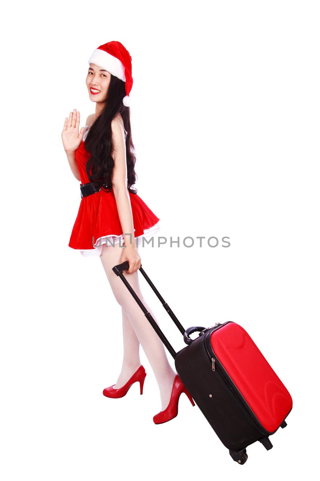 happy woman in Santa Claus clothes with suitcase isolated on a white background